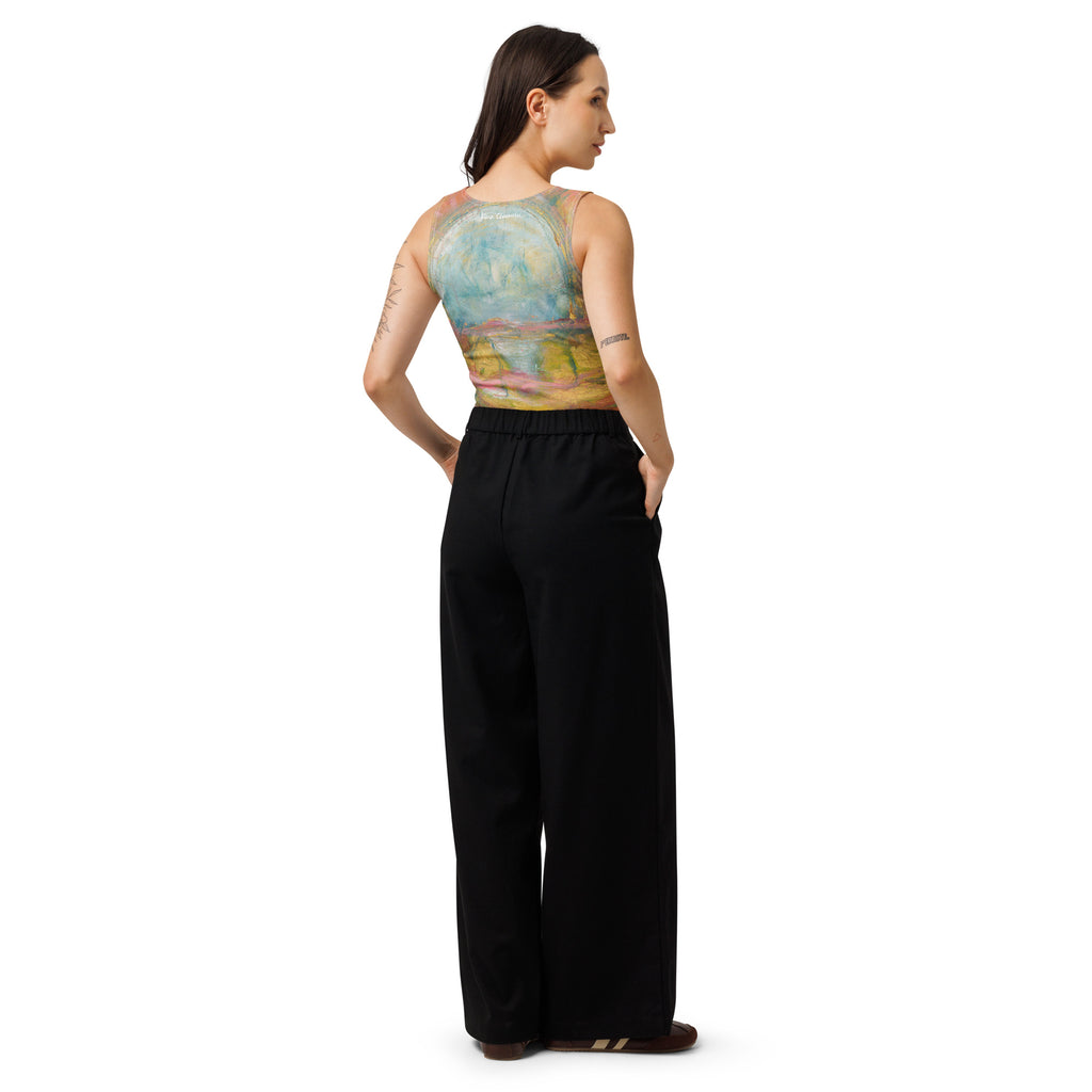 Back view of model in the crop top and black trousers, the blue circle across her shoulders