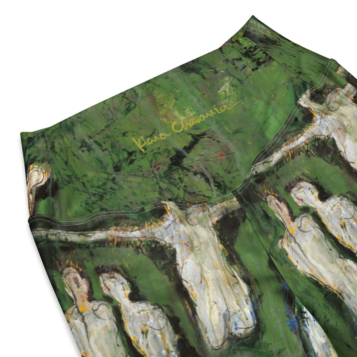 Close-up of the back waistband with the gold artist signature over a row of pale figures with outstretched arms