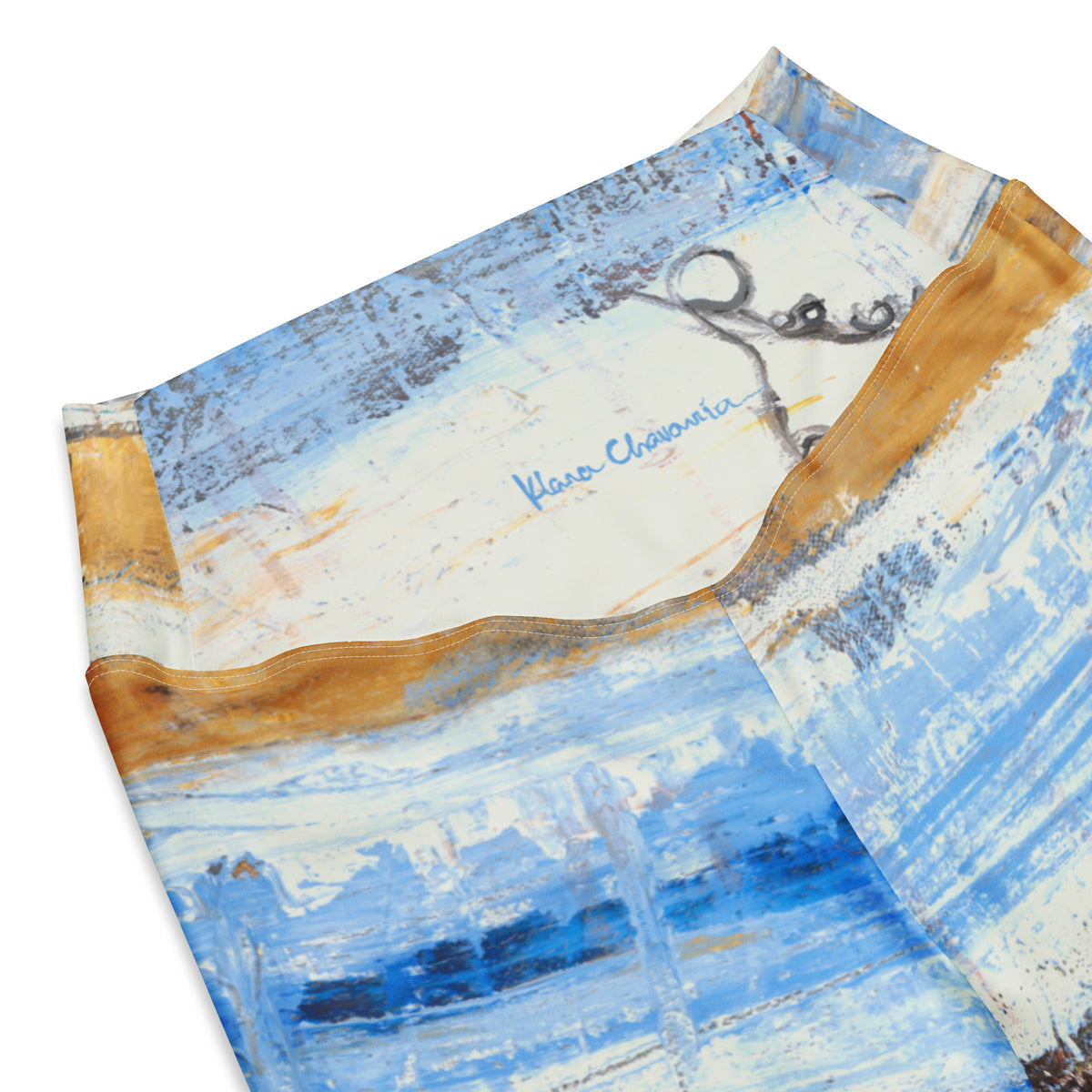 Close-up of the waistband with a blue signature over cream and a curly gray line drawing
