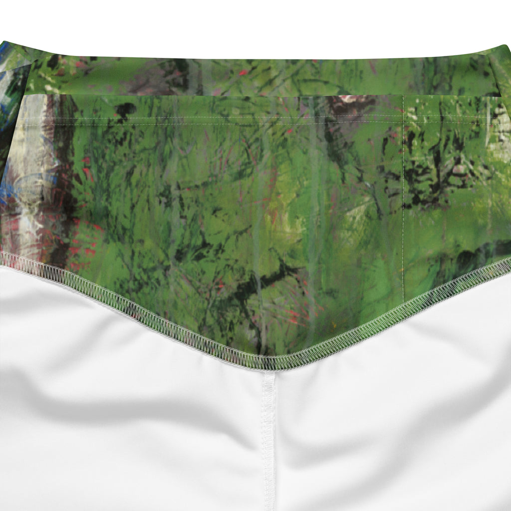 Close-up of the inside back waistband, green print with stitched seams over white lining