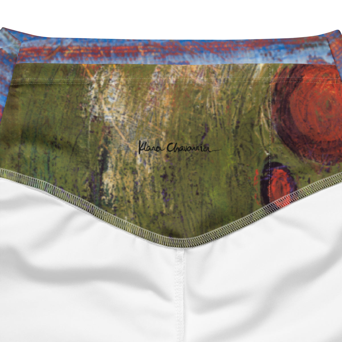 Inside back waistband with a black signature on green grass strokes and a red circle