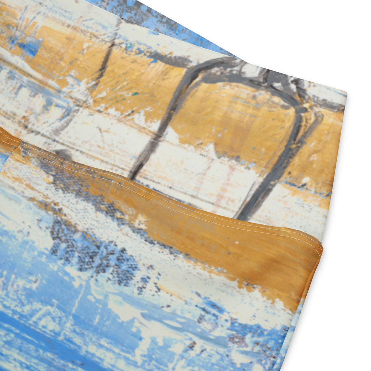 Close-up of the ochre waistband seam over brushy blue and white paint with gray arches