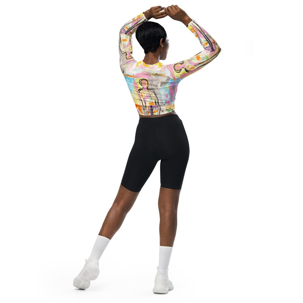 Back view of model with hands clasped overhead, crop top and black bike shorts