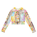 Flat front of a crop top with black-outlined figures in pink, blue and yellow watercolor, THE VIEW I by Klara Chavarría