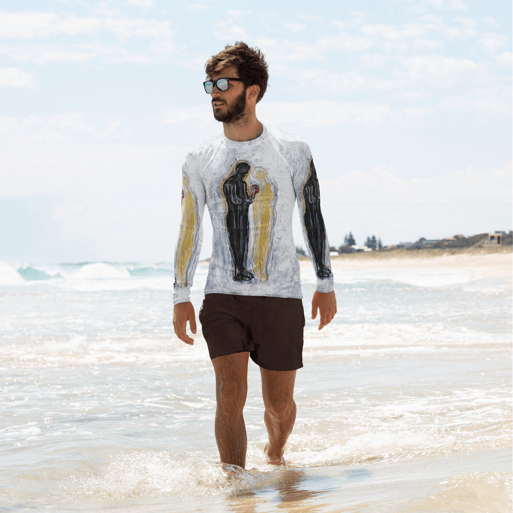 Man walking in beach surf wearing the white rash guard with black and gold figures, THE GIFT by Klara Chavarría