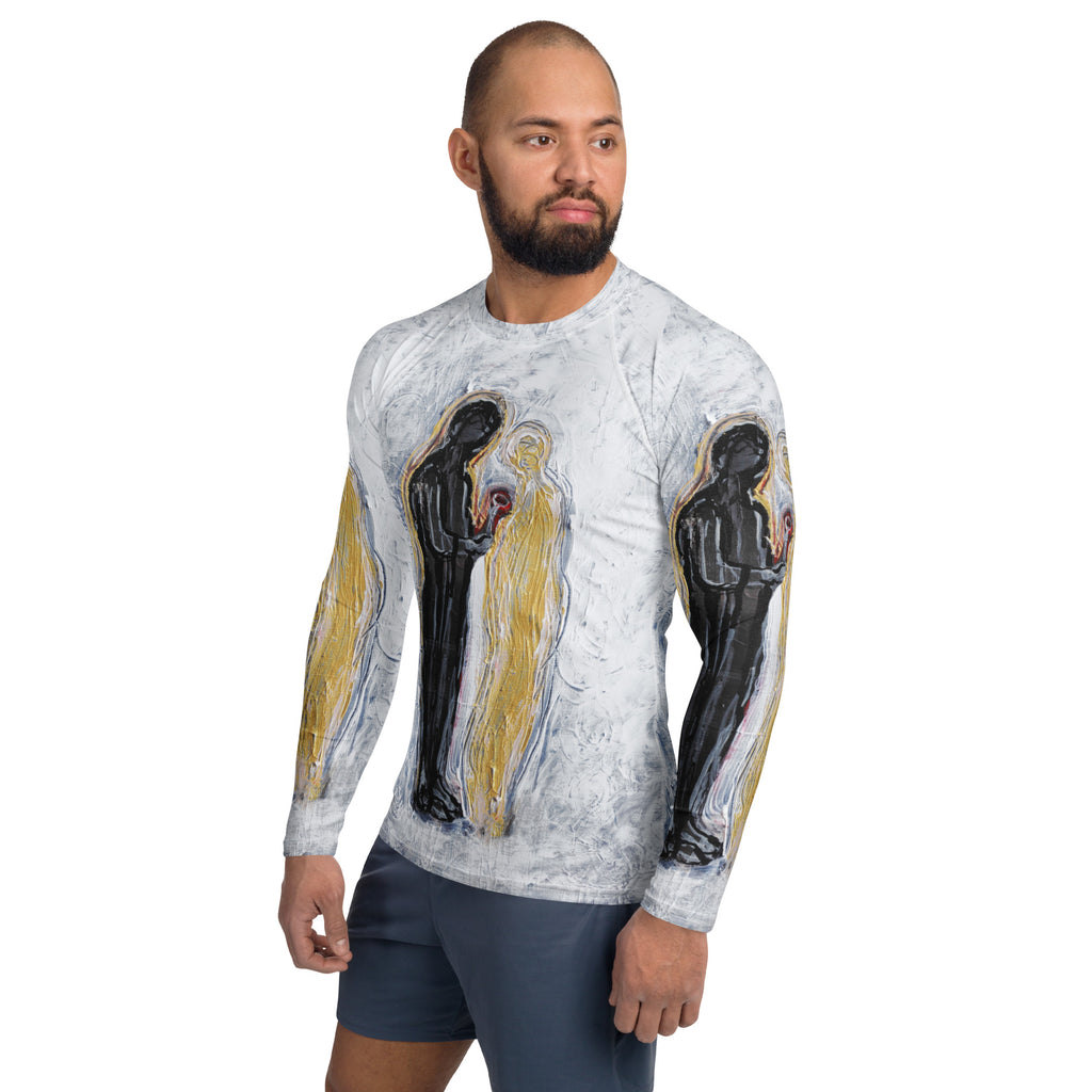 Three-quarter view of model in the rash guard and blue shorts, figures repeated on sleeves
