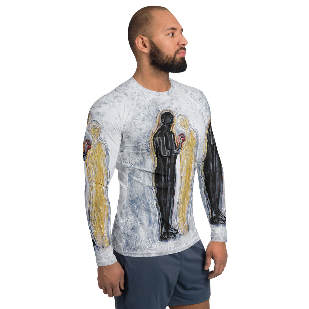 Side profile of model in the long sleeve rash guard, black and gold figures across chest and arm