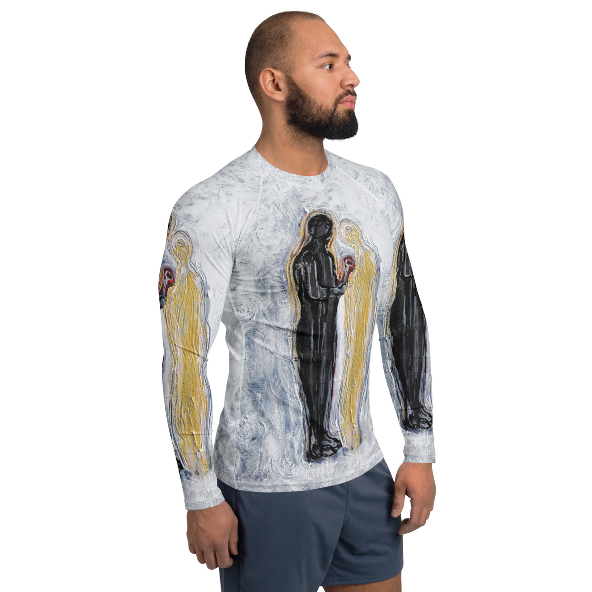 Side profile of model in the long sleeve rash guard, black and gold figures across chest and arm