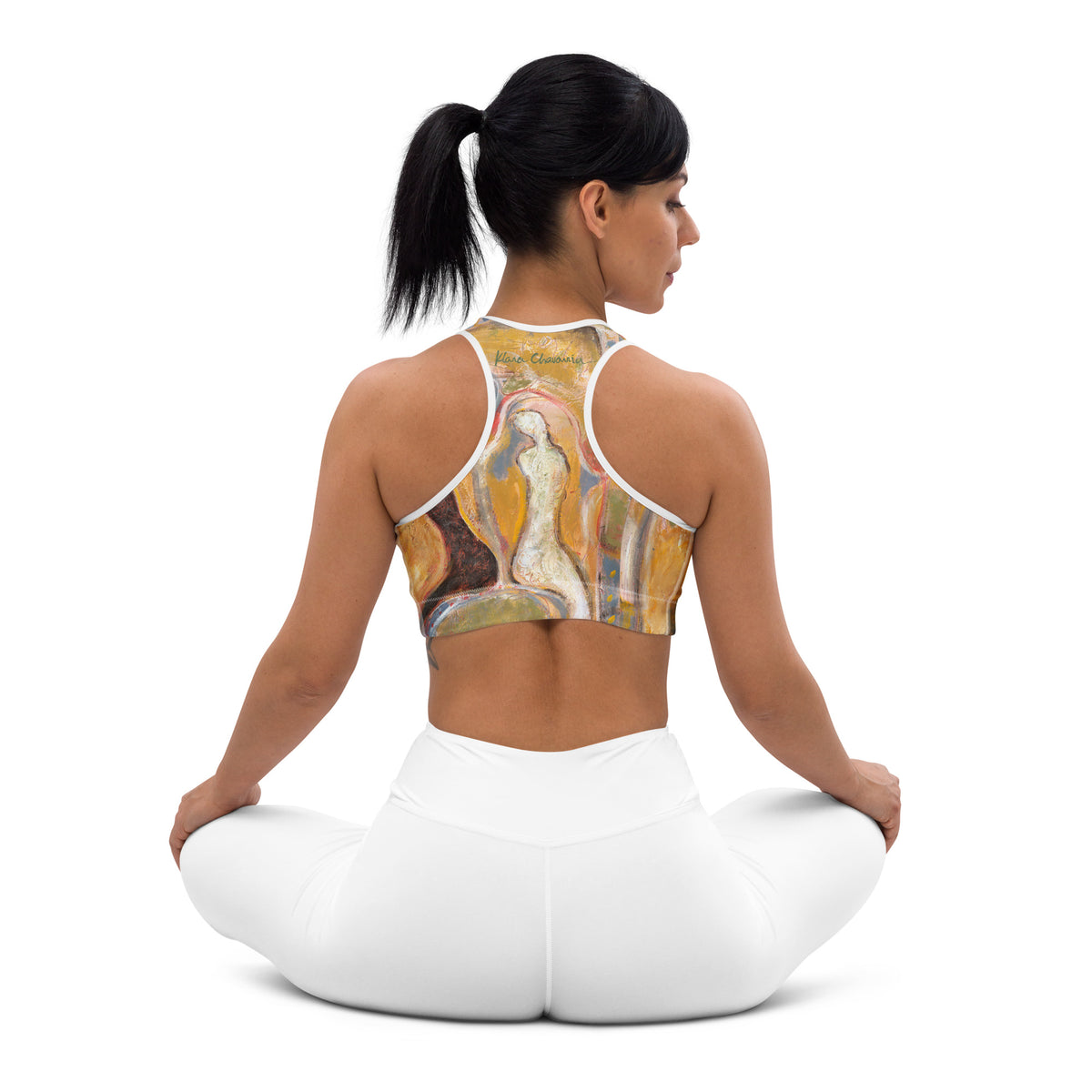 Seated cross-legged back view showing the figure and signature on the racerback