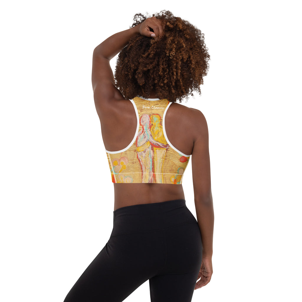 Back view of model with hand in hair, racerback showing the embracing figures and signature