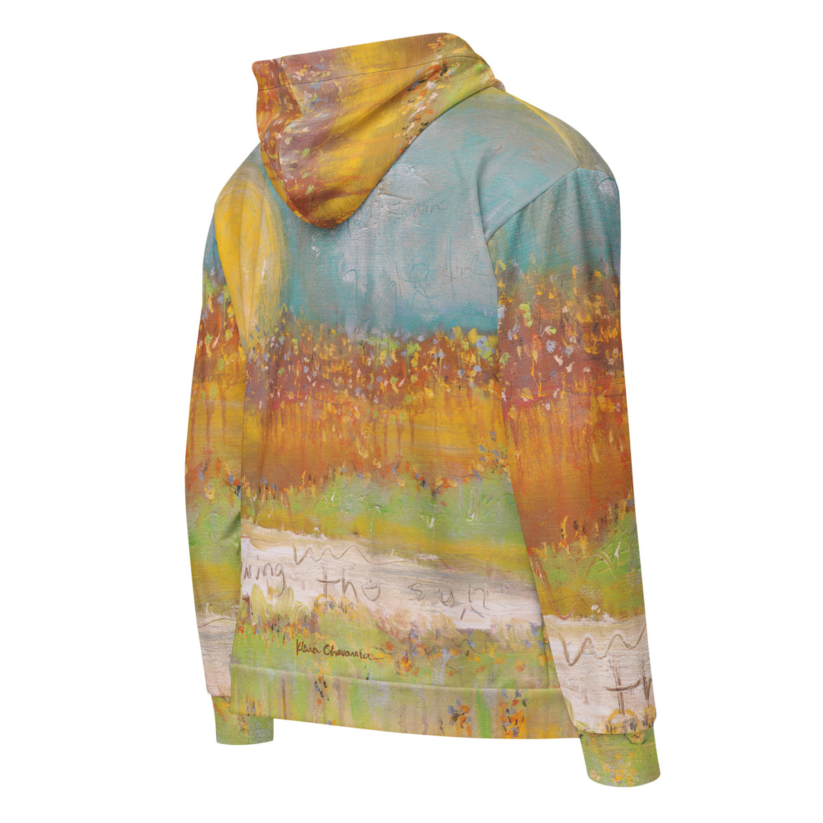 Right back three-quarter view of the FOLLOWING THE SUN zip hoodie, painted orange and green meadow with handwritten words and Klara Chavarría's signature