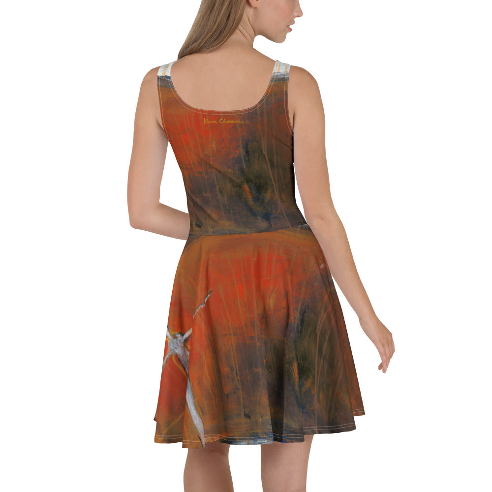 Back view of model in the dress with a gold signature below the neckline