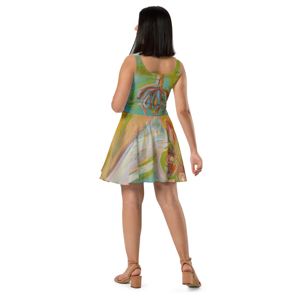 Back view of model in tan sandals, turquoise upper back and Klara Chavarría signature below the neckline