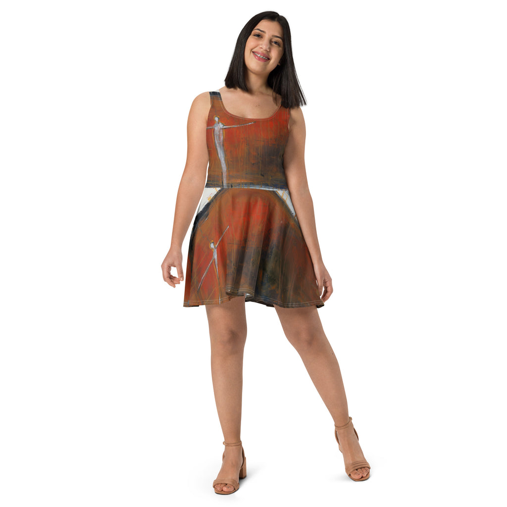 Front view of smiling model in the dress and tan sandals, figures on bodice and skirt