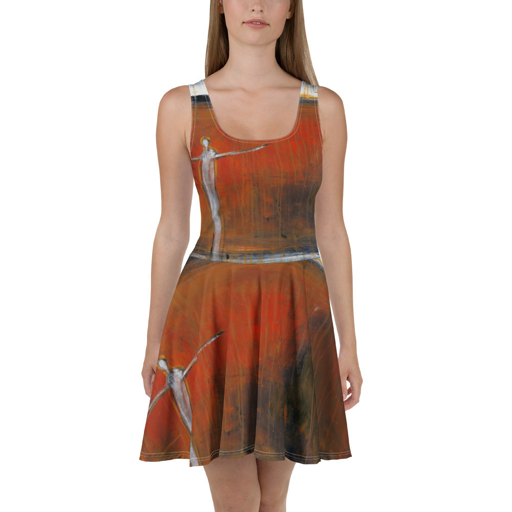 Front view of model in the rust dress, figures on the bodice and skirt