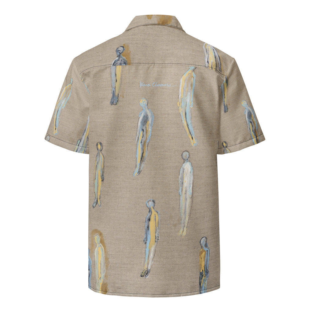 Flat back of the shirt with scattered figures and a pale blue signature below the collar