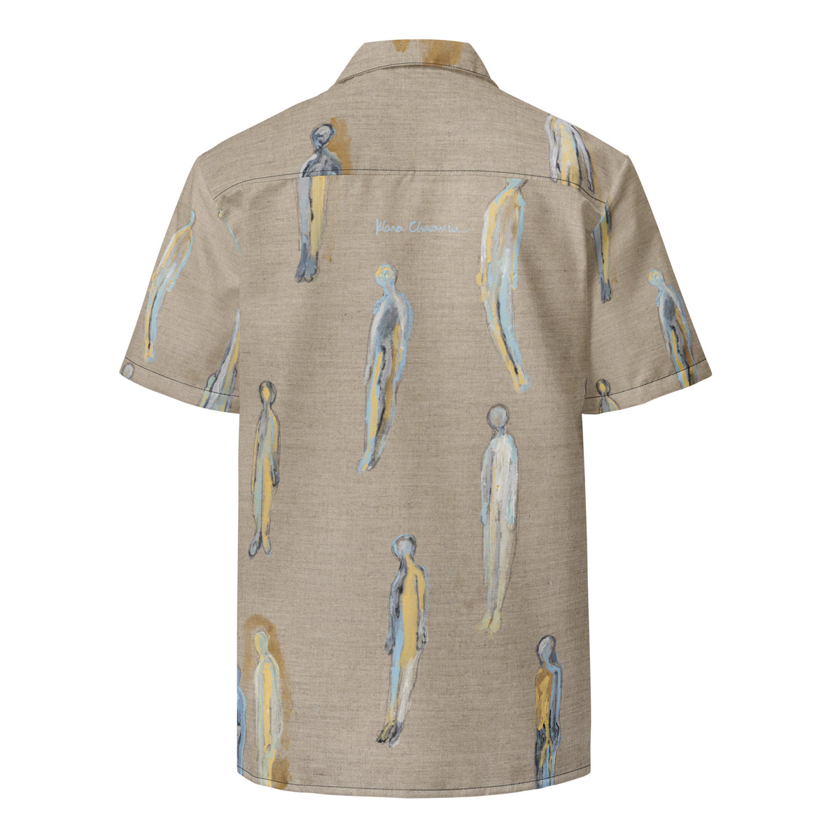 Flat back of the shirt with scattered figures and a pale blue signature below the collar