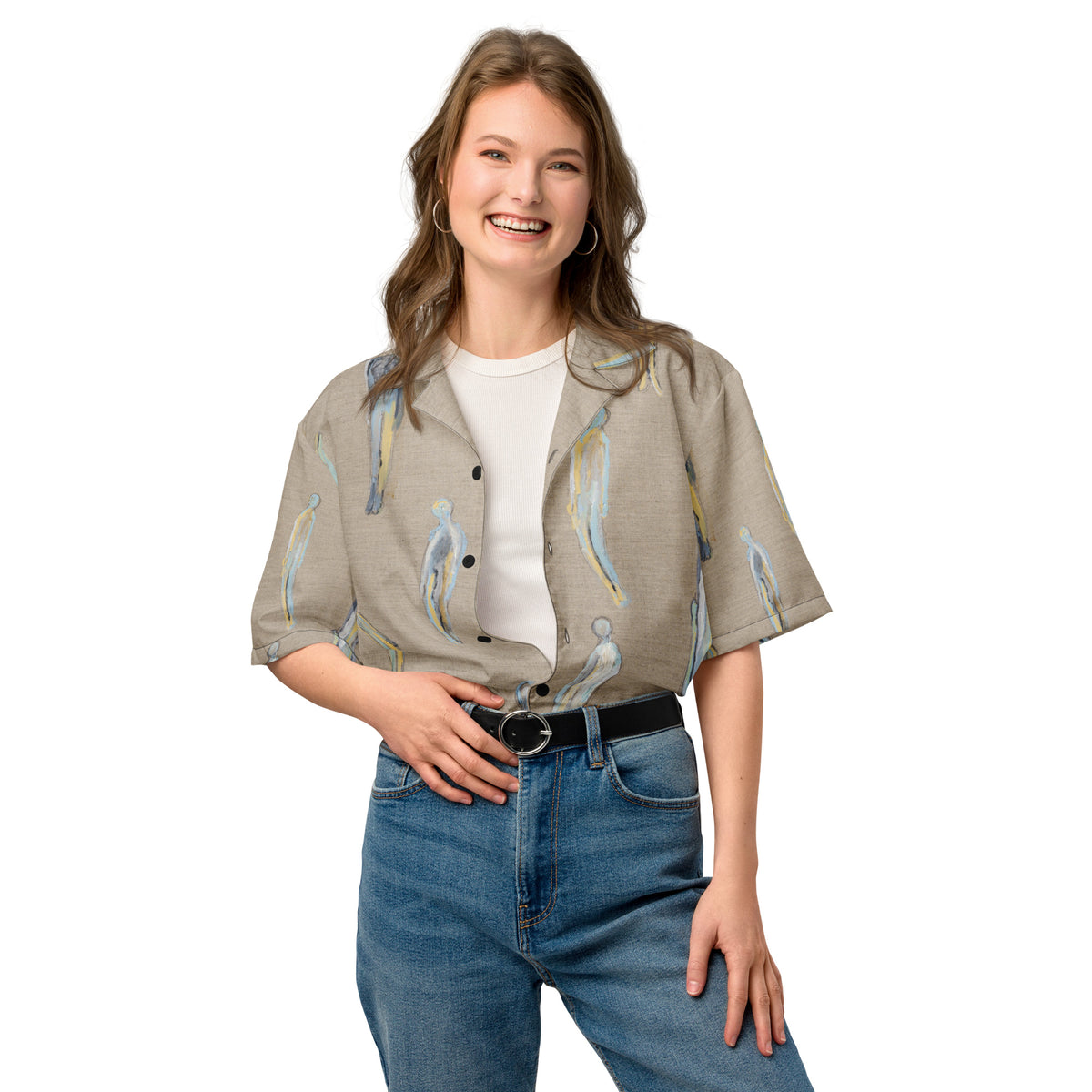 Smiling model in the shirt half tucked into belted blue jeans