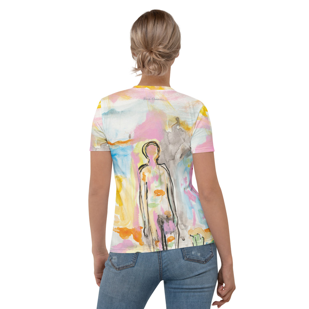 Back view of blonde model with hair in a bun, tee showing the figure and small signature