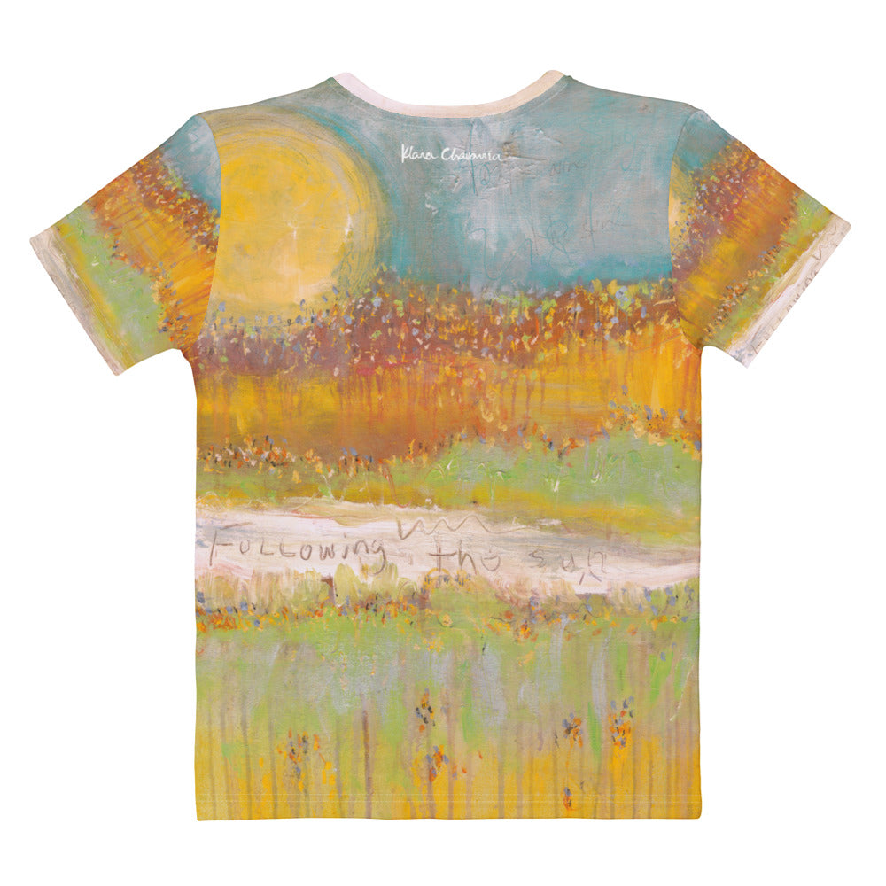 Flat back of the tee with a large yellow sun and the words Following the sun on a pale band
