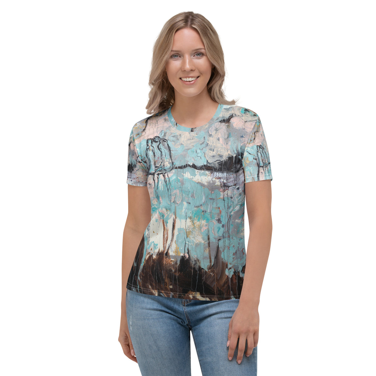Smiling model in the aqua, pink and brown print tee and light jeans, front view