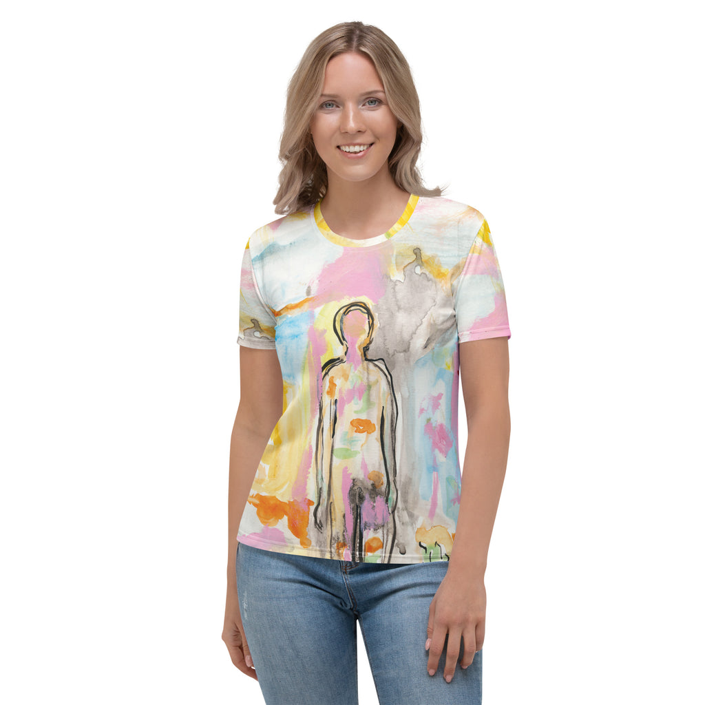 Smiling model with wavy blonde hair facing forward in the pastel figure tee and jeans