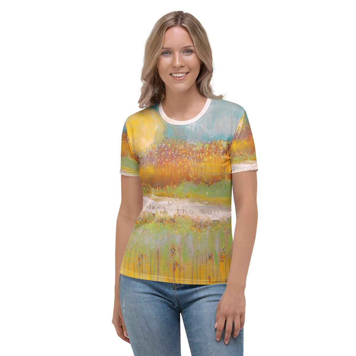 Smiling model in a tee with a yellow sun over an orange and green field, FOLLOWING THE SUN by Klara Chavarría