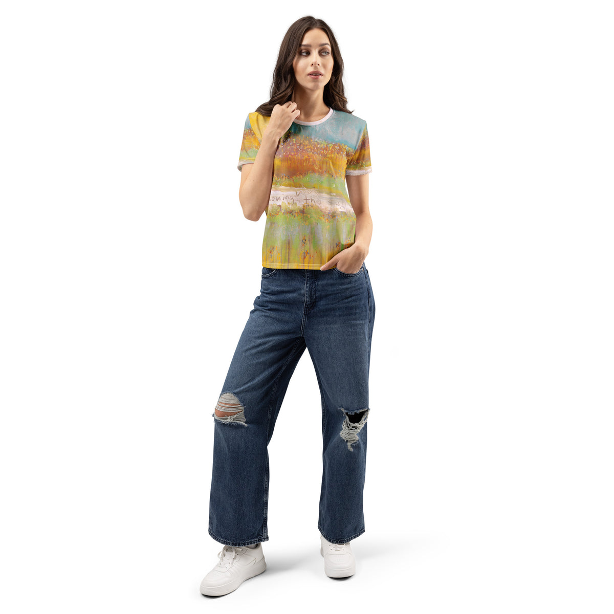Full-length model in the painted tee, ripped wide-leg jeans and white sneakers