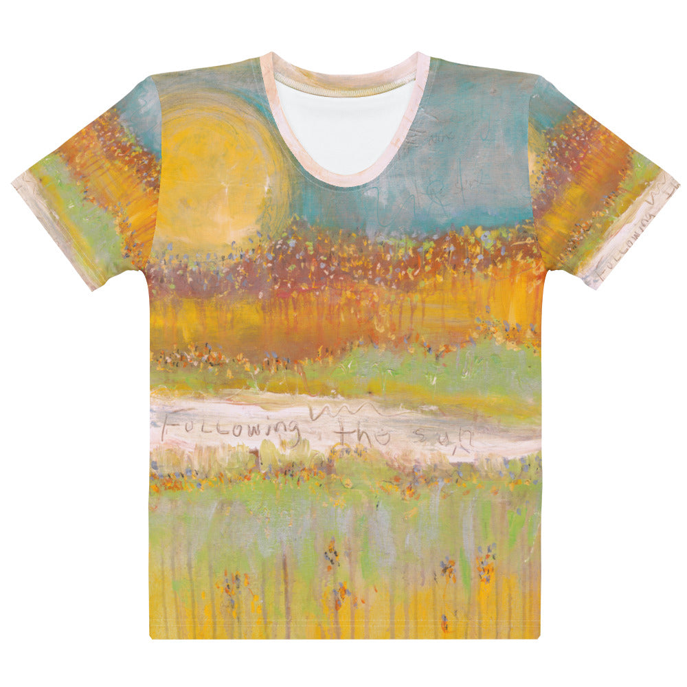 Flat front of the crew neck tee with a pink trimmed collar, sun, orange field and green grass