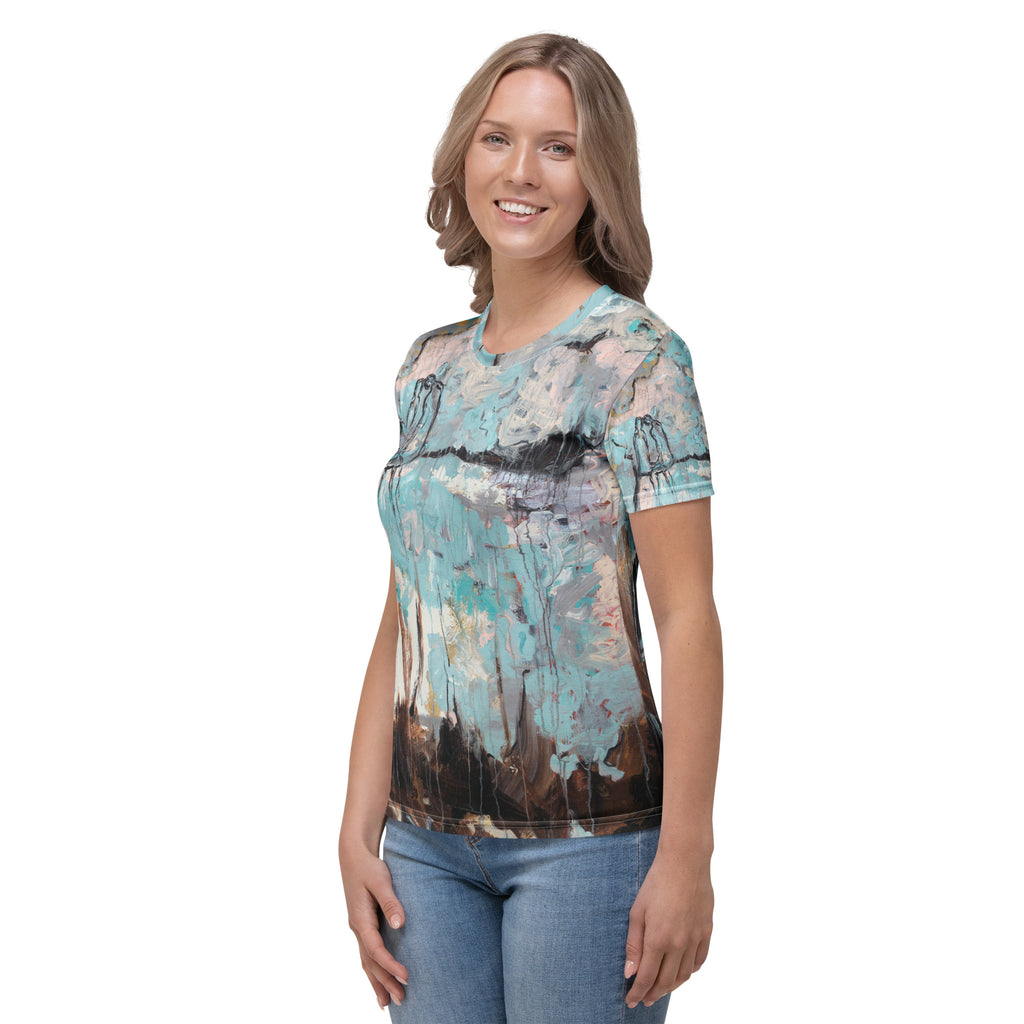 Three-quarter view of smiling model in the tee, brown painted base along the hem