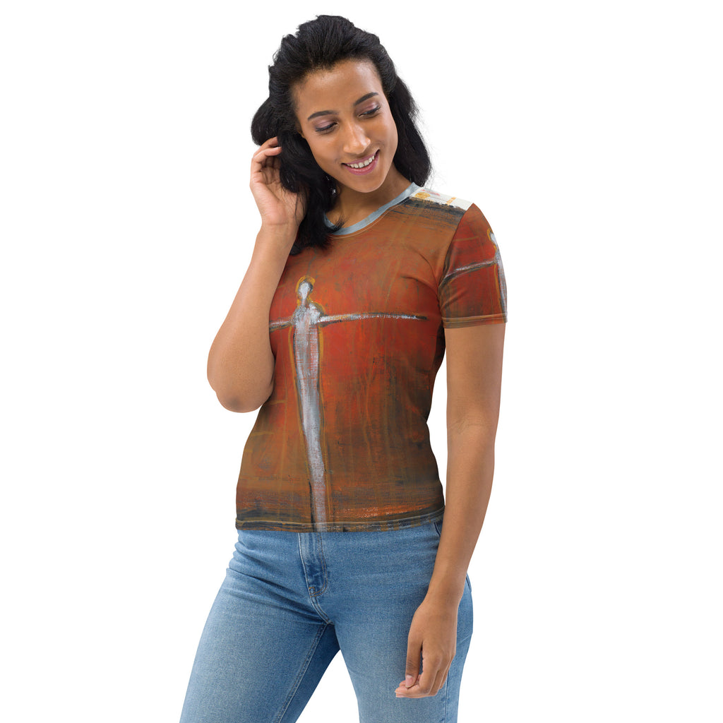 Smiling model looking down in the tee and light jeans, hand touching her hair