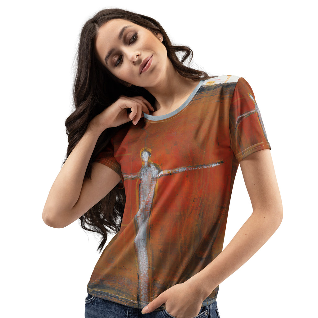 Model tilting her head with hand at her neck, front of the rust tee with the pale figure