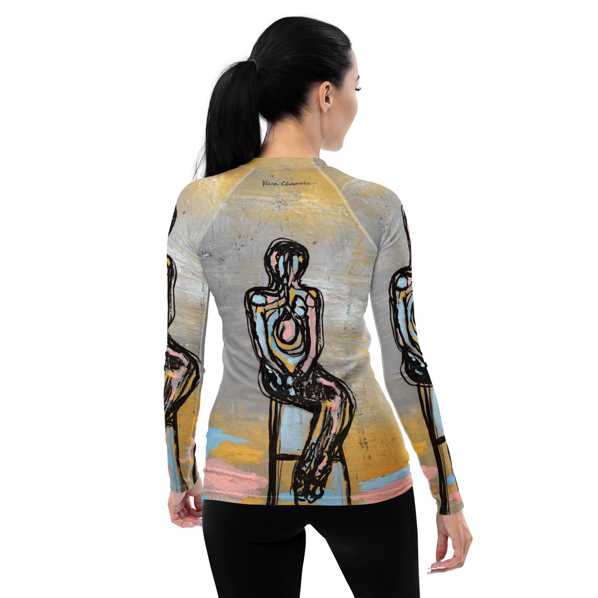 Back view of model with a ponytail in the rash guard showing the seated figure and signature