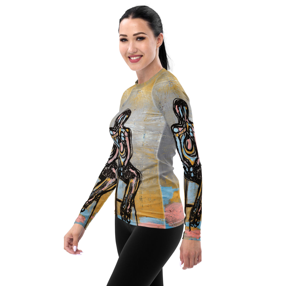 Smiling model in a side view in the rash guard, a figure printed down the sleeve