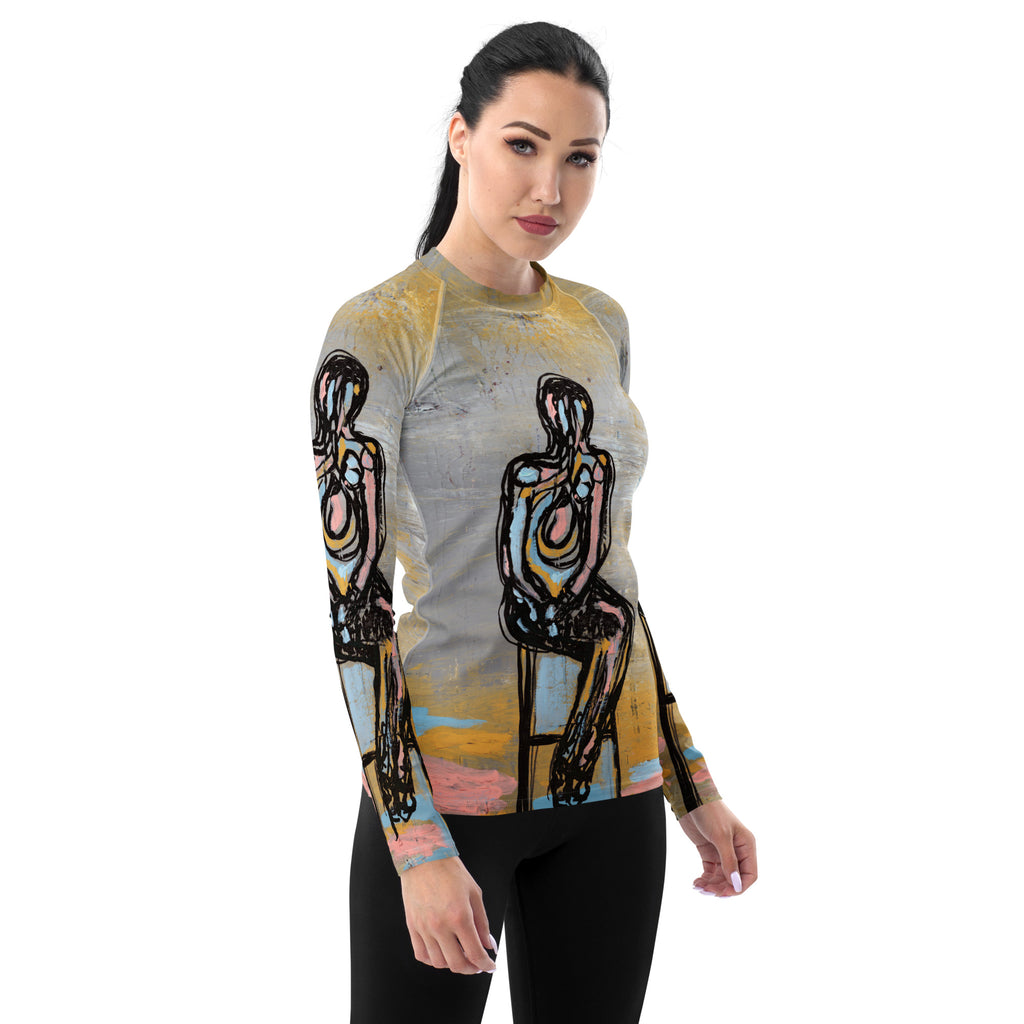 Model with dark hair pulled back in the rash guard and black leggings, front three-quarter view