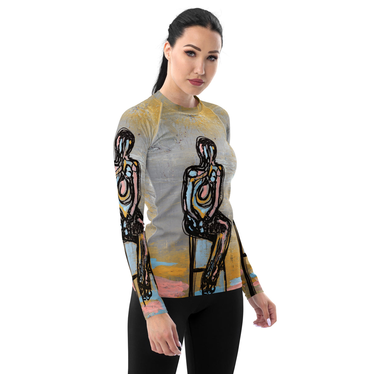 Model with dark hair pulled back in the rash guard and black leggings, front three-quarter view
