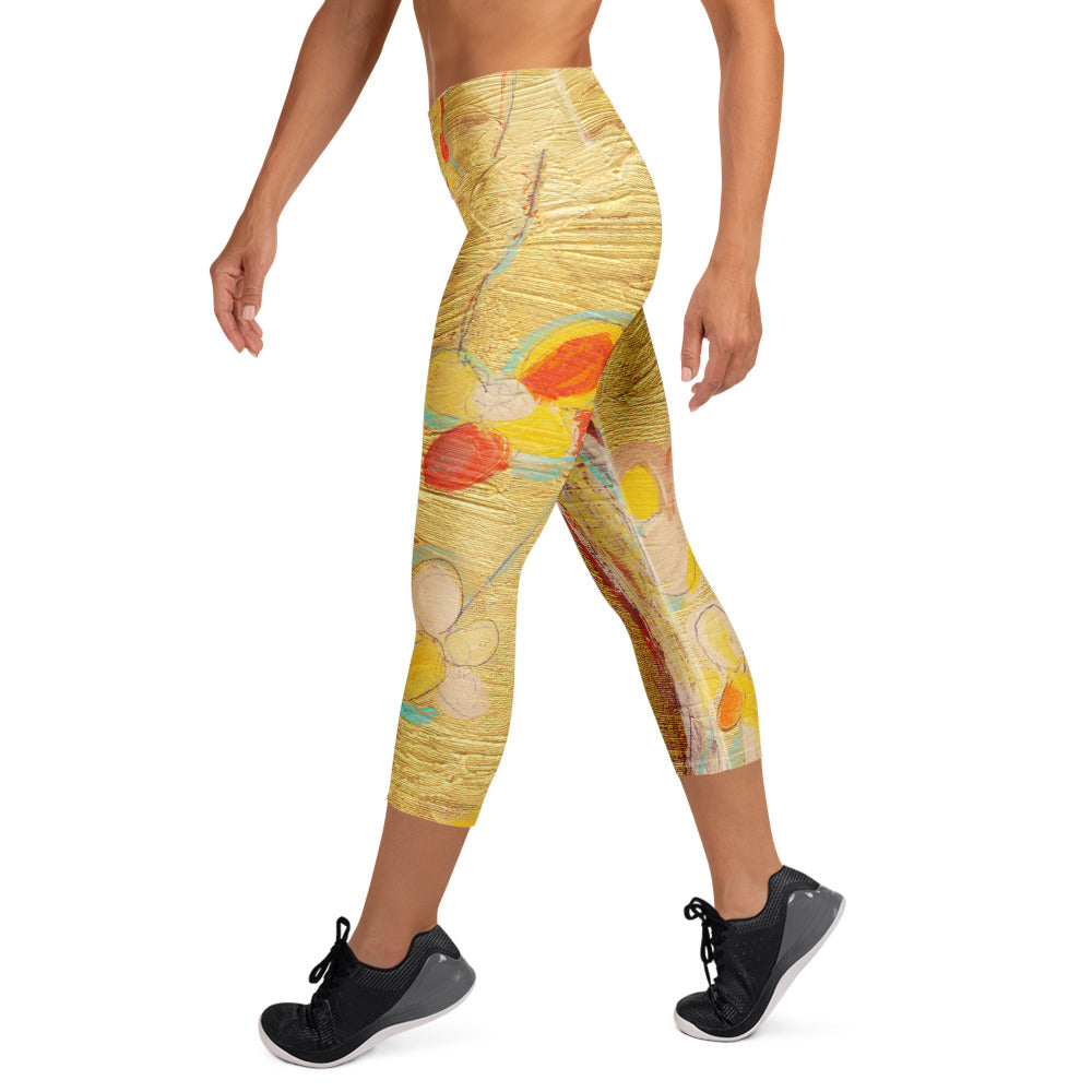 Side view of model in sneakers walking, orange and cream flowers on the gold leg