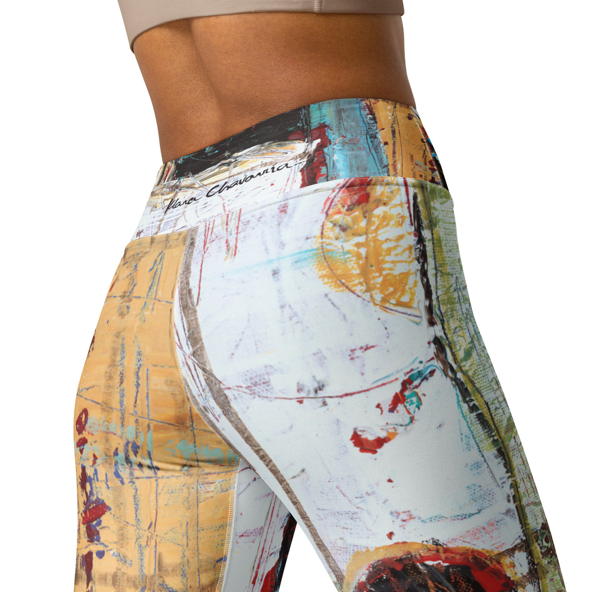 Close-up of the back waistband with a black signature over white, ochre and green panels