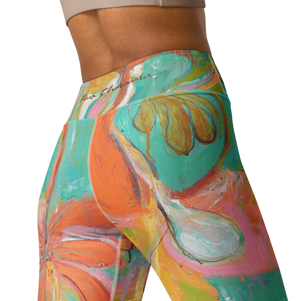 Close-up of the back waistband with signature, orange petals and a white droplet shape