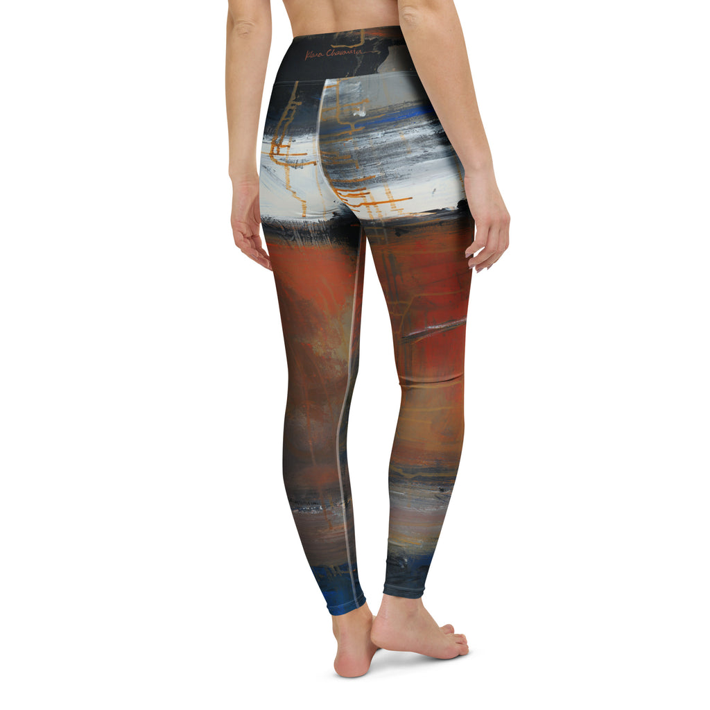Back view of the leggings in white and gray strokes over rust, gold lines and a signature