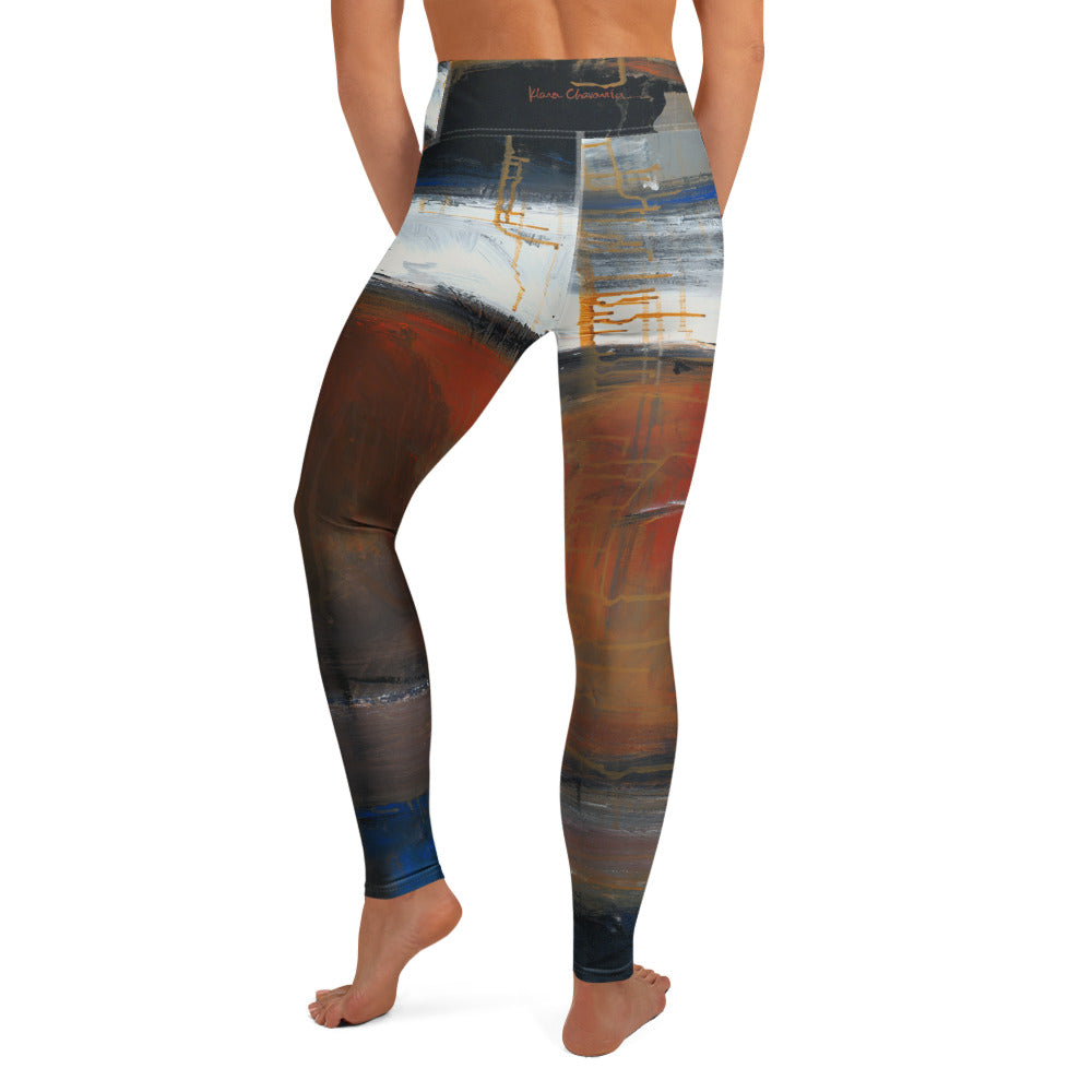 Barefoot back view showing a dark waistband with a small red signature and navy hems