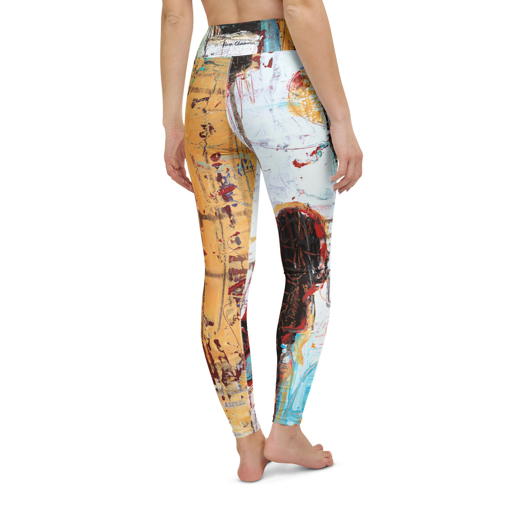 Barefoot back view of the leggings with a small signature on the waistband and ochre and white legs