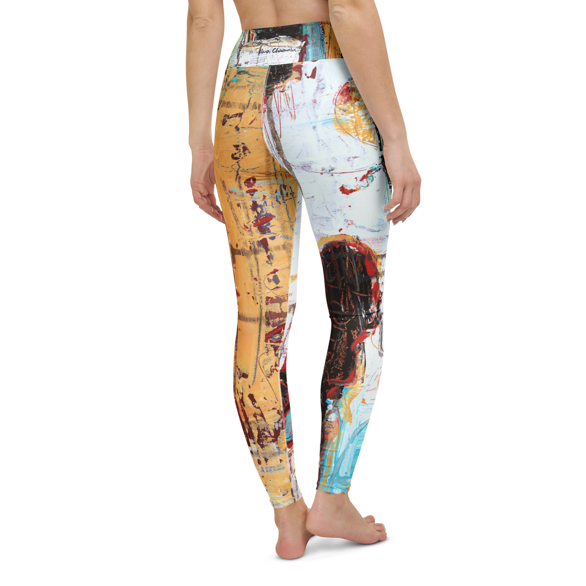 Barefoot back view of the leggings with a small signature on the waistband and ochre and white legs