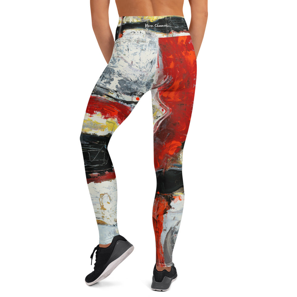 Back view of the leggings with a large red panel and white signature on the waistband