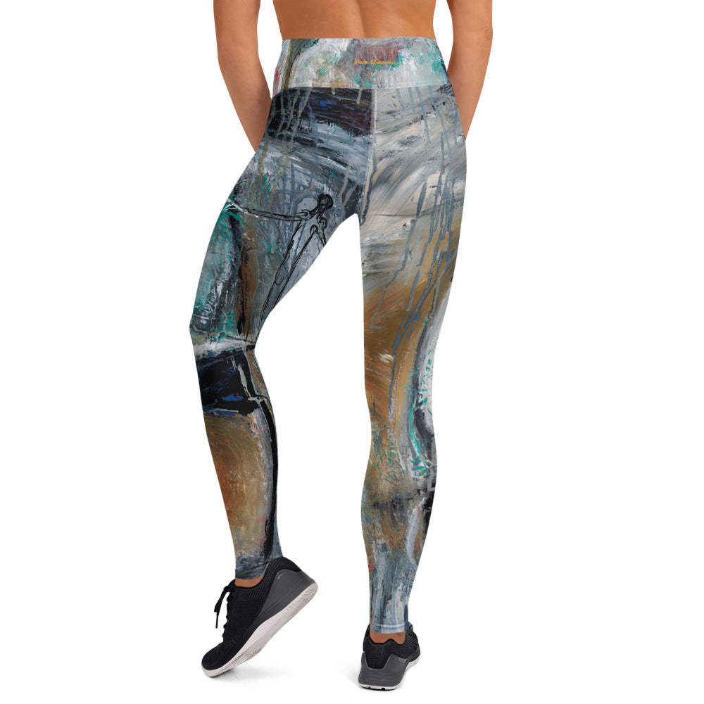 Back view of the high-waist leggings showing a thin drawn figure and small gold signature