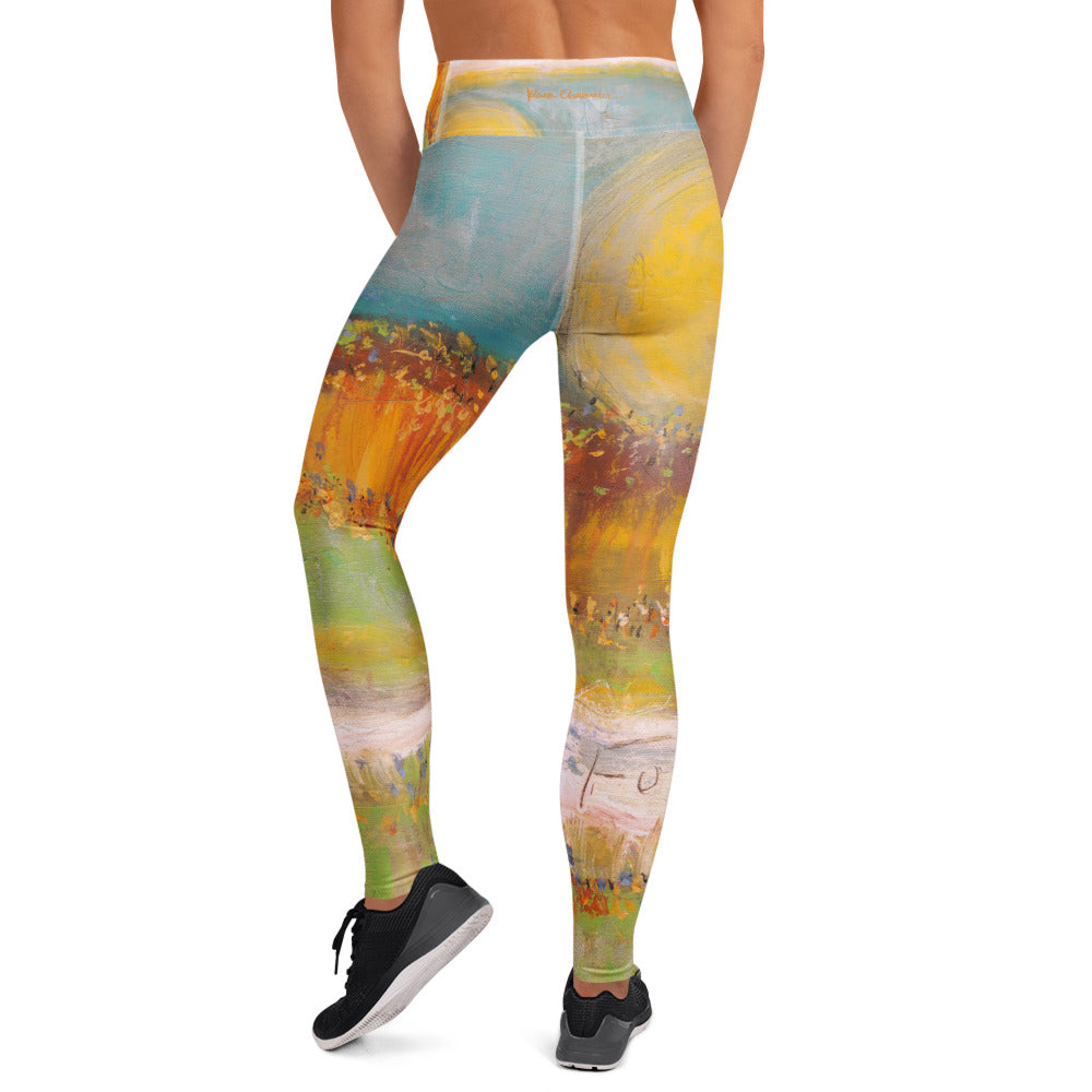 Back view of the leggings with a small orange signature on the waistband above a yellow sun