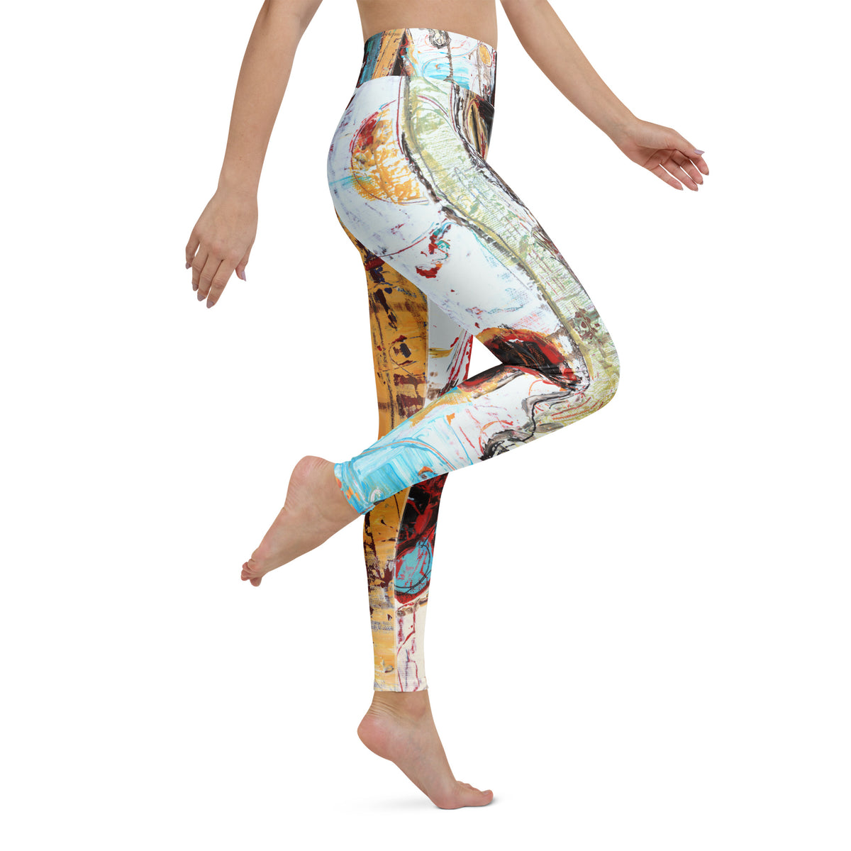 Side view of barefoot model lifting one knee, leggings in white, pale green and sky blue
