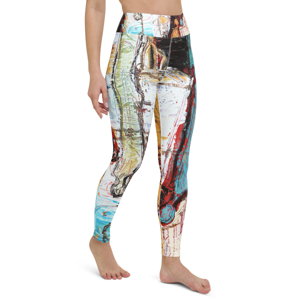 Barefoot model in a front three-quarter view, leggings in white, green, red and teal strokes