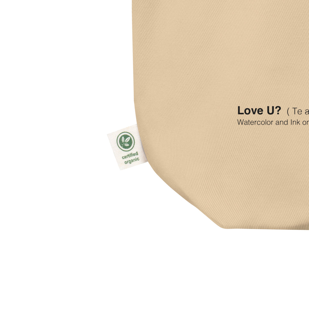 Close-up of the tote corner with a certified organic label and the Love U? watercolor caption