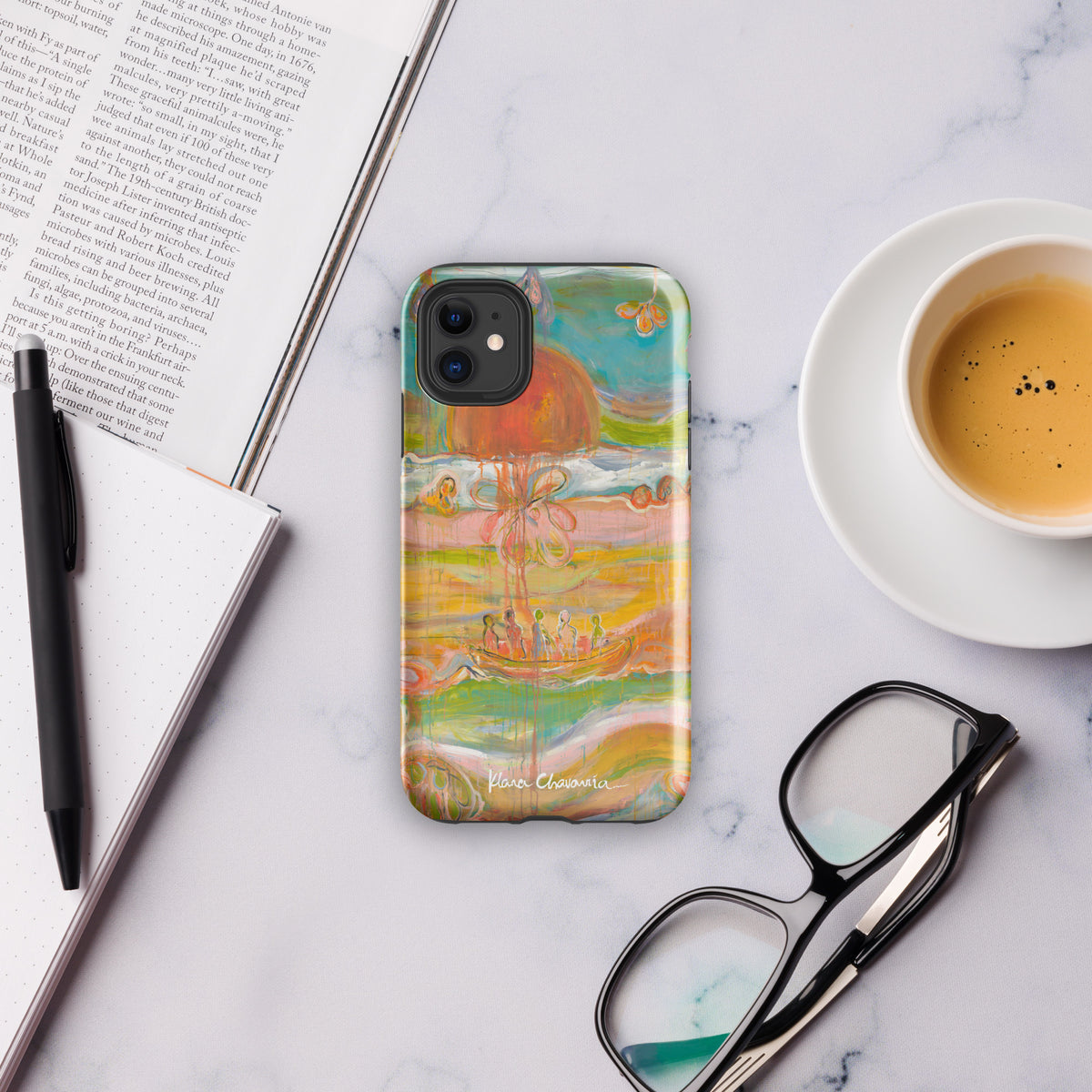 Boat and orange sun phone case on marble beside an open book, pen, coffee cup and glasses (Glossy)